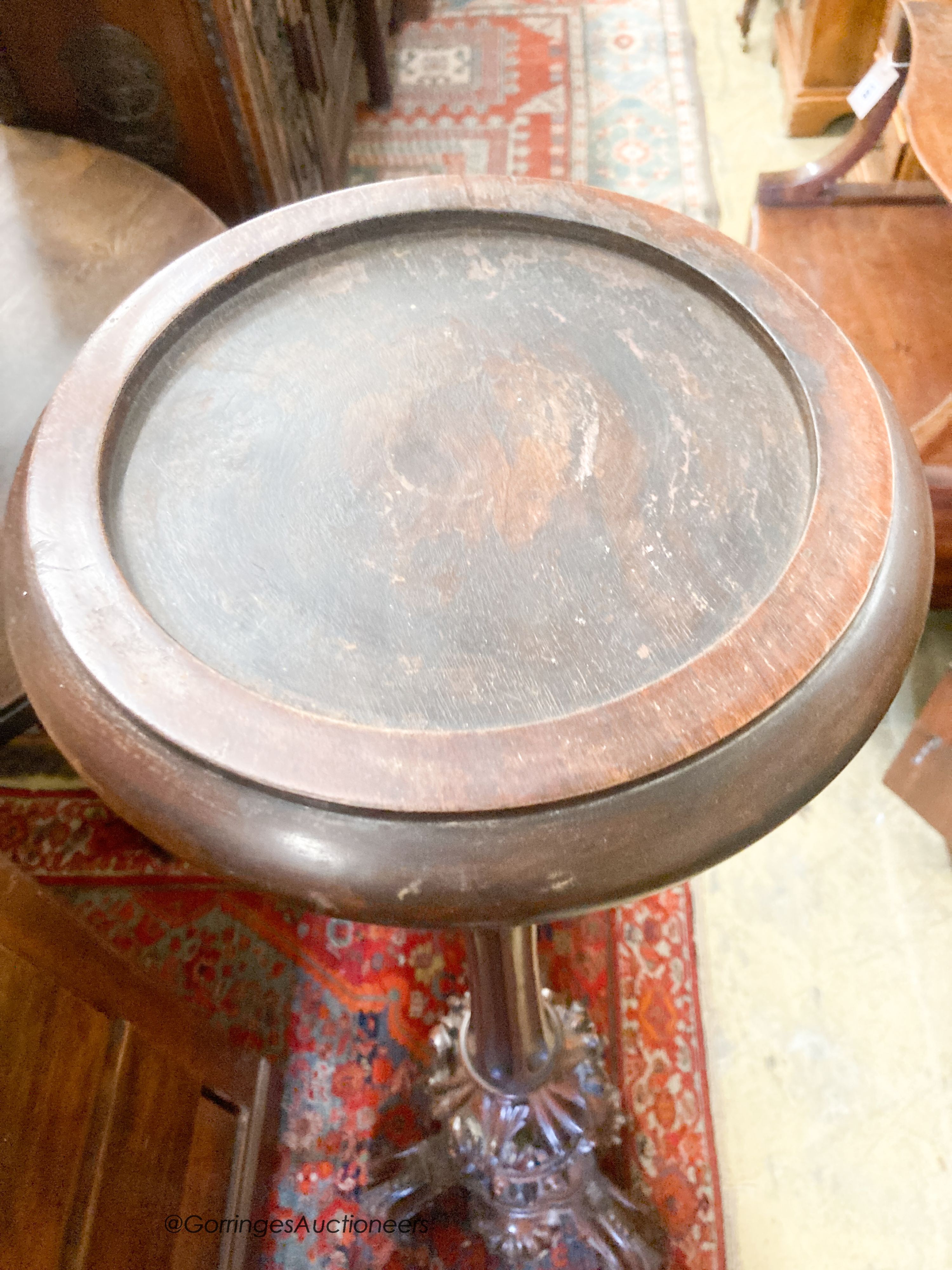 A late Victorian carved mahogany torchere, height 120cm